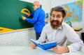 Two teachers in classroom. Back to school. Education. Prepare for exam. College lecturer on lesson. Royalty Free Stock Photo