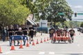 Two teams push beds down street in charity fundraising event