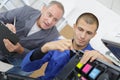 Two technicians repairing printer Royalty Free Stock Photo