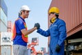 Two technicians show action of join and collaborate for good working in cargo container area