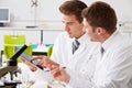 Two Technicians Working In Laboratory Royalty Free Stock Photo