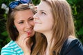 Two teen girl friends sharing secret Royalty Free Stock Photo