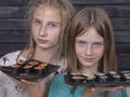 Portrait couple young girl with sushi, close up Royalty Free Stock Photo