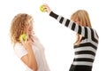 Two teen girlfriends eating green apples Royalty Free Stock Photo