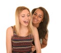 Two Teen Girls Laughing on White Background Royalty Free Stock Photo