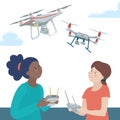 Two teen girls playing with drones outdoors