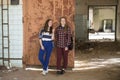 Two teen girls standing at the iron door Royalty Free Stock Photo