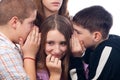 Two teenage boys and girl gossiping Royalty Free Stock Photo