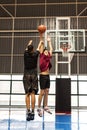 Two teenage boys playing basketball together on the court Royalty Free Stock Photo