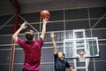 Two teenage boys playing basketball together on the court Royalty Free Stock Photo