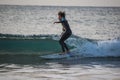 Two teenage boys are surfing before school in Japan Royalty Free Stock Photo