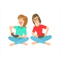 Two Teenage Girlfriends Sitting With Legs Crossed Playing Video Games With Controllers, Part Of Women Different Royalty Free Stock Photo