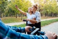 Two teenage girls on a scooter taking selfie. Royalty Free Stock Photo