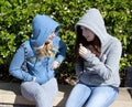 Two Teenage Girls, Sitting and Talking Royalty Free Stock Photo