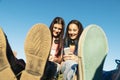 Two Teenage Girls Using Mobile In Park