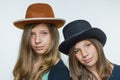 Two teenage girls wearing hats Royalty Free Stock Photo