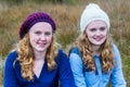 Two teenage girls wearing hats in nature Royalty Free Stock Photo