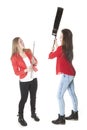 Two teenage sisters play flute and guitar in studio Royalty Free Stock Photo
