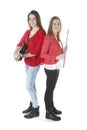 Two teenage sisters play flute and guitar in studio Royalty Free Stock Photo