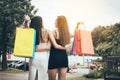 Two teenager beautiful asian woman holding shopping bag at shopping market outdoor. Royalty Free Stock Photo