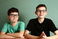 Two teenager boys in myopia glasses close up
