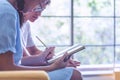 Two teenager campus students stressful tutoring and reading books together. Friends discussing, making a note help each other Royalty Free Stock Photo