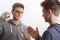 Two teenagers communicating with sign language