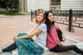 Two teenagers resting on the stairs