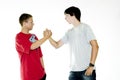 Two teenagers shaking hands Royalty Free Stock Photo