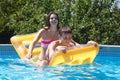 Two teenagers swimming in the pool Royalty Free Stock Photo