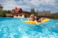 Two teenagers swimming in the pool Royalty Free Stock Photo