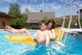 Two teenagers swimming in the pool Royalty Free Stock Photo