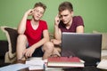 Two teenagers troubleshooting together studying