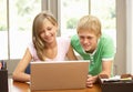 Two Teenagers Using Laptop At Home Royalty Free Stock Photo