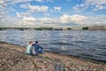 Two teenages sitting by the walls of Peter and Paul fortress.