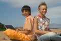 Two teens with laptops Royalty Free Stock Photo