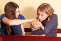 Two teens with orange cat