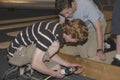 Two teenagers are working on a carpentry project