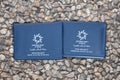 Two temporary Israeli passports lying on the stone background Royalty Free Stock Photo