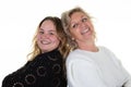 Two tender beautiful women of different ages generations together on white background daughter and elderly mother happy laughing Royalty Free Stock Photo