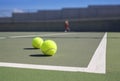 Two tennis ball near baseline Royalty Free Stock Photo