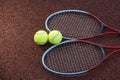 Two tennis balls and two racquets on tennis court Royalty Free Stock Photo