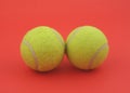 Two tennis balls on red Royalty Free Stock Photo