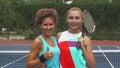 Two tennis girls smiling at camera Royalty Free Stock Photo