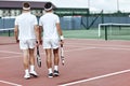 The end of the game. Tennis players leave the court after the match