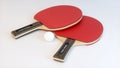 Two Tennis Rackets With a Ping-Pong Ball on a Soft White Studio Background.