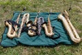 Two tenors, three altos and a bari saxophones on a blanket Royalty Free Stock Photo