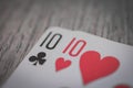 Two tens, Playing cards in hand on the table, poker nands