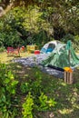 Two tents camping site in tropical forest Royalty Free Stock Photo