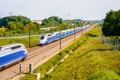 Two TGV high speed trains passing each other in the french countryside Royalty Free Stock Photo
